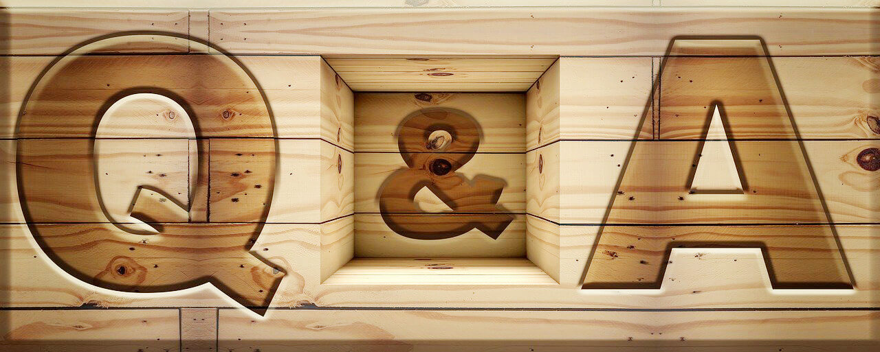Letters Q&A on a wooden background